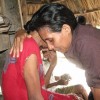 A researcher comforts her informant Memori-Memori Terlarang