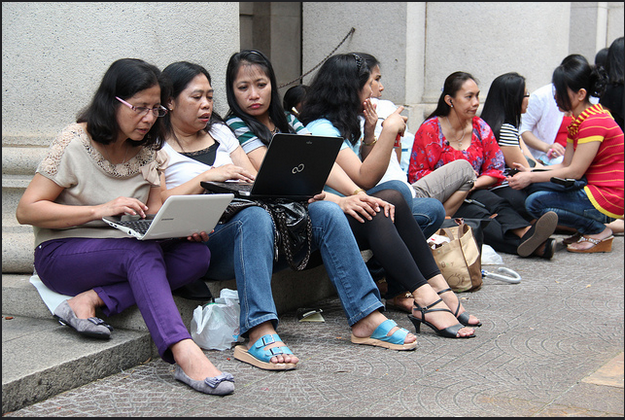 A luxury too far? Migrant workers in Hong Kong rely on laptops to contact their families - KC Wong (https://www.flickr.com/photos/77290926@N07/7128911245)