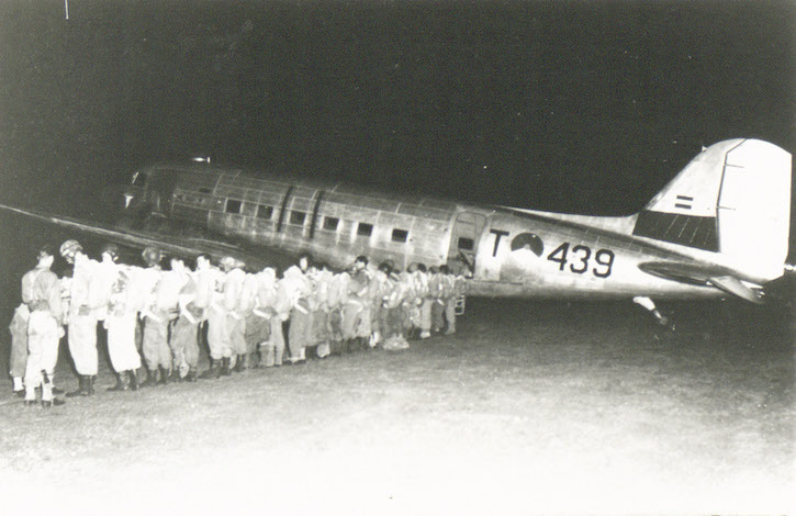 Soldiers of the 1st Parachutists Company of the Corps Special Troops get ready for departure early in the morning at airfield Tjililitan (Jakarta) in a Dakota that will drop them above Jambi (Operation Magpie). Credit: Nederlands Instituut voor Militaire Historie (Netherlands Institute for Military History)