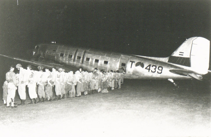 Soldiers of the 1st Parachutists Company of the Corps Special Troops get ready for departure early in the morning at airfield Tjililitan (Jakarta) in a Dakota that will drop them above Jambi (Operation Magpie). Credit: Nederlands Instituut voor Militaire Historie (Netherlands Institute for Military History) Soldiers of the 1st Parachutists Company of the Corps Special Troops get ready for departure early in the morning at airfield Tjililitan (Jakarta) in a Dakota that will drop them above Jambi (Operation Magpie). Credit: Nederlands Instituut voor Militaire Historie (Netherlands Institute for Military History)
