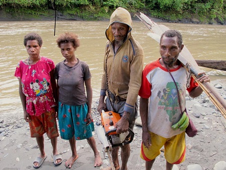 Bauzi men preparing to go down the river to fell a few trees, and hunt a few animals  Bobby Anderson